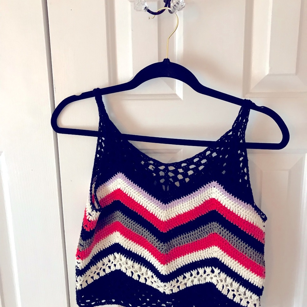 Up for grabs is a cute crochet top size small🦋